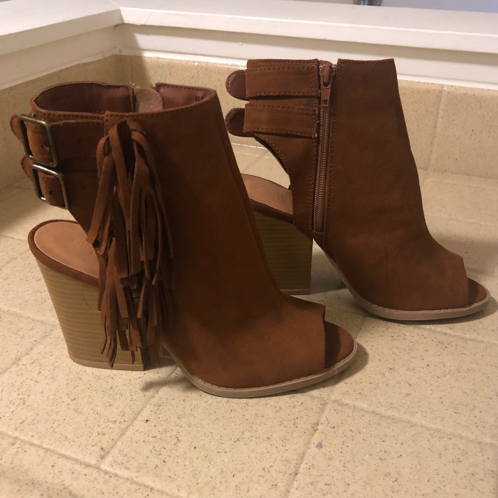Brown peep toe booties with fringe detail